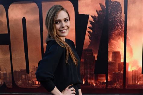 Elizabeth Olsen accidentally flashes underwear in Paris